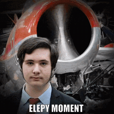 Man In Suit And Tie In Front Of Airplane Elepy Moment GIF