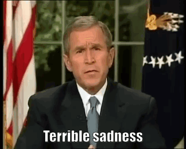 Man In Suit And Tie In Front Of American Flag GIF