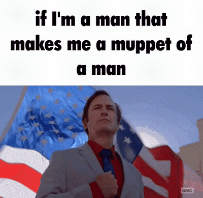 Man In Suit And Tie In Front Of American Flag With Fist In Pocket GIF