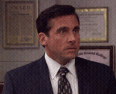 Man In Suit And Tie In Front Of Award Certificate GIF