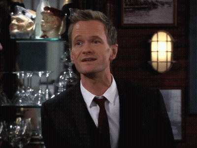 Man In Suit And Tie In Front Of Bar GIF