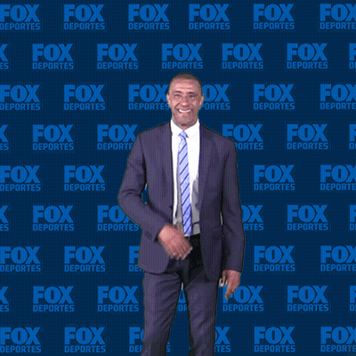 Man In Suit And Tie In Front Of Blue Background Saying Fox Deportes GIF