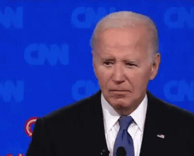 Man In Suit And Tie In Front Of CNN Logo GIF