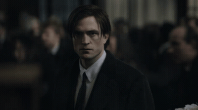 Man In Suit And Tie In Front Of Crowd GIF