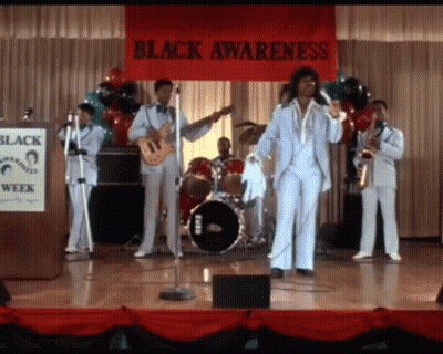 Man In Suit And Tie In Front Of Crowd GIF