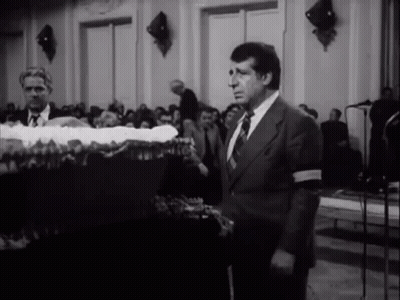Man In Suit And Tie In Front Of Crowd GIF
