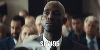 Man In Suit And Tie In Front Of Crowd With Spy195 GIF