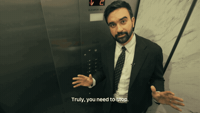 Man In Suit And Tie In Front Of Elevator Saying Truly You Need To Stop GIF