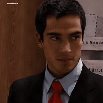 Man In Suit And Tie In Front Of Endez G Wall GIF