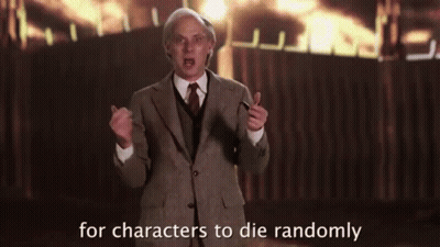 Man In Suit And Tie In Front Of Fire GIF