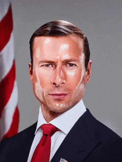 Man In Suit And Tie In Front Of Flag GIF