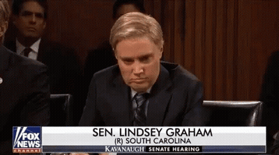 Man In Suit And Tie In Front Of Fox News Banner GIF