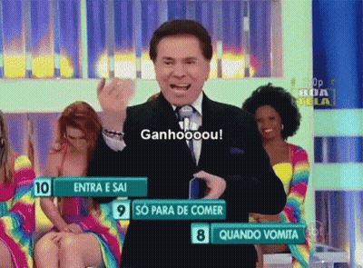 Man In Suit And Tie In Front Of Ganhooou Sign GIF