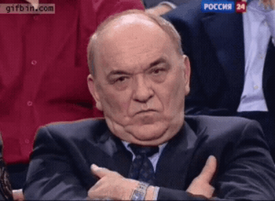 Man In Suit And Tie In Front Of Gifbin Screen GIF