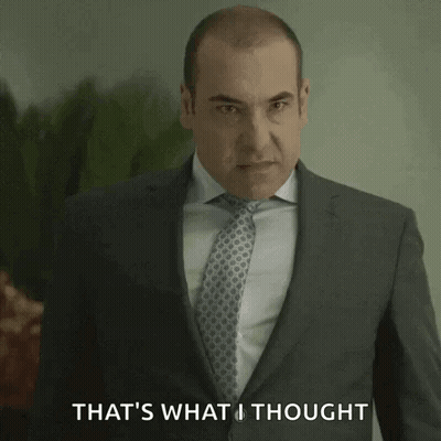 Man In Suit And Tie In Front Of Glass Wall Saying A2B3R GIF