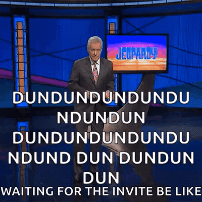 Man In Suit And Tie In Front Of Jeopardy Screen GIF