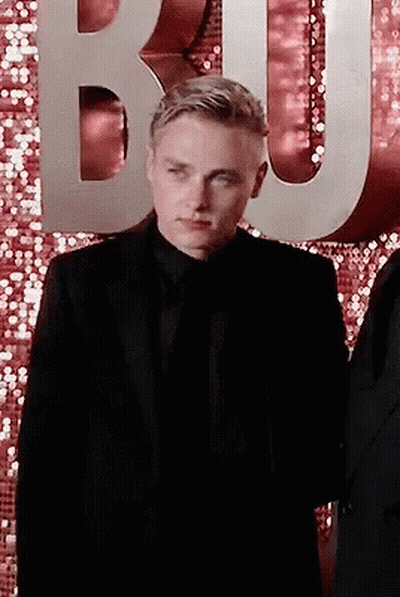 Man In Suit And Tie In Front Of Letter B GIF