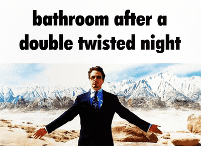Man In Suit And Tie In Front Of Mountain Saying Bathroom After A Double Twisted Night GIF