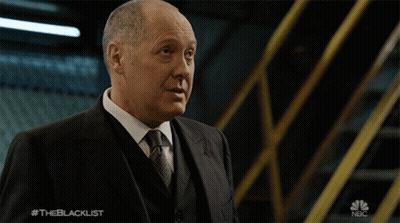 Man In Suit And Tie In Front Of NBC Sign GIF