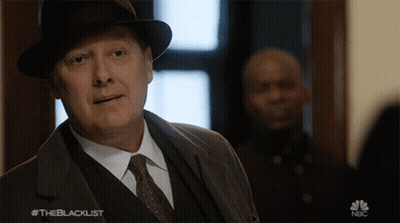 Man In Suit And Tie In Front Of NBC Sign GIF