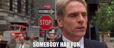 Man In Suit And Tie In Front Of Stop Sign GIF