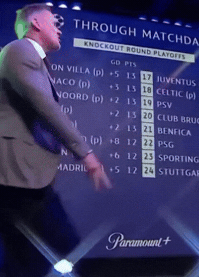Man In Suit And Tie In Front Of Through Matches Screen GIF