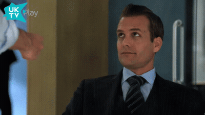 Man In Suit And Tie In Front Of UK TV Play Logo GIF