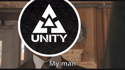 Man In Suit And Tie In Front Of Unity Logo GIF