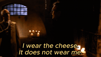 Man In Suit And Tie In Front Of Window With Candle GIF