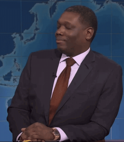 Man In Suit And Tie In Front Of World Map GIF