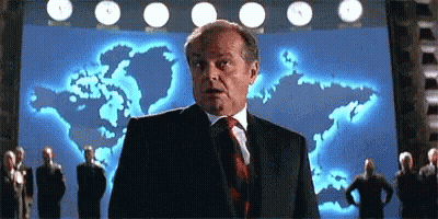Man In Suit And Tie In Front Of World Map GIF