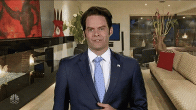 Man In Suit And Tie In Living Room GIF