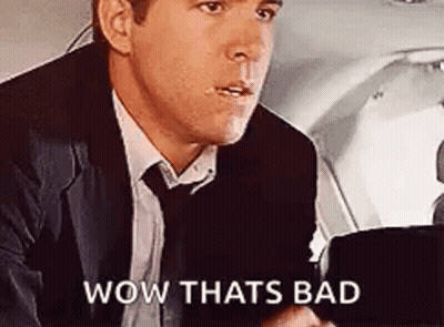 Man In Suit And Tie In Plane Back Seat GIF