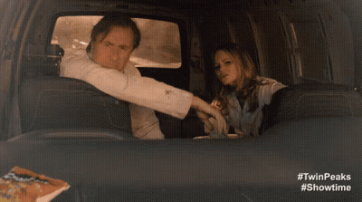 Man In Suit And Tie In Plane Back Seat GIF