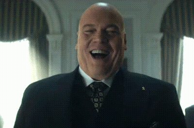 Man In Suit And Tie Laughing GIF