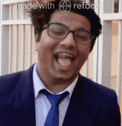 Man In Suit And Tie Laughing GIF