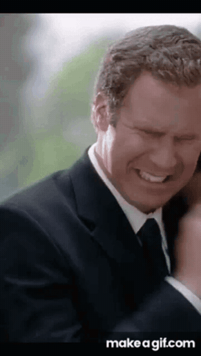 Man In Suit And Tie Laughing Eyes Closed GIF