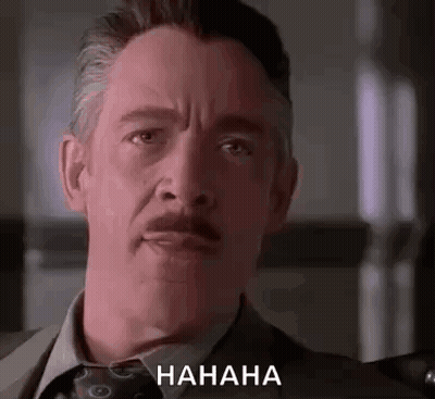 Man In Suit And Tie Laughing GIF