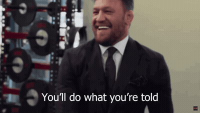 Man In Suit And Tie Laughing Says Youll Do What Youre Told GIF