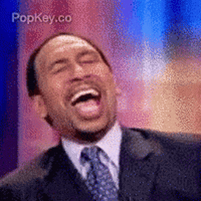 Man In Suit And Tie Laughing With Popkey.co GIF