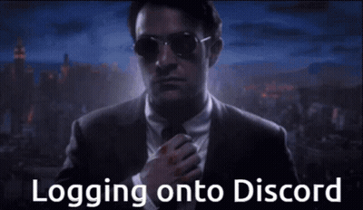 Man In Suit And Tie Logging Onto Discord GIF