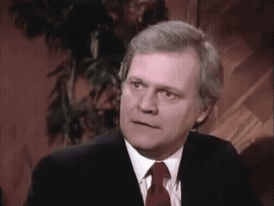 Man In Suit And Tie Looking GIF