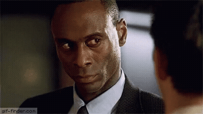 Man In Suit And Tie Looking At Another Man GIF