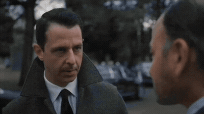 Man In Suit And Tie Looking At Another Man GIF