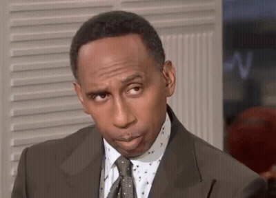 Man In Suit And Tie Looking At Camera GIF