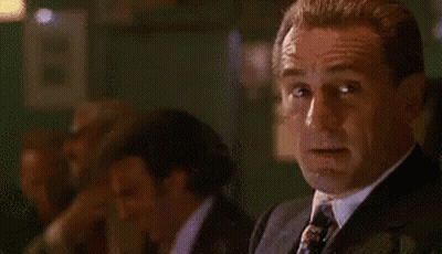 Man In Suit And Tie Looking At Camera GIF