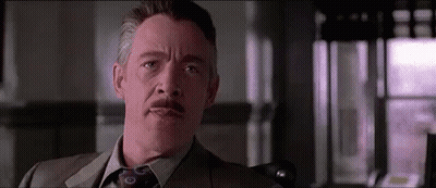 Man In Suit And Tie Looking At Camera GIF