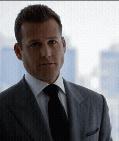 Man In Suit And Tie Looking At Camera GIF
