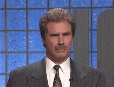 Man In Suit And Tie Looking At Camera GIF