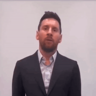 Man In Suit And Tie Looking At Camera GIF